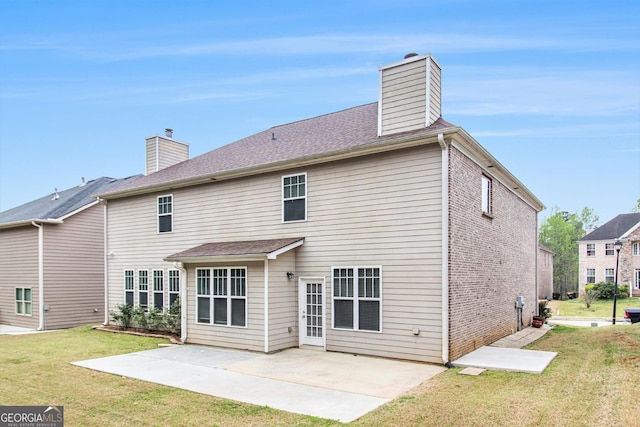 2036 Broadmoor Way, Fairburn, GA 30213 - rear view of house with a chimney, a patio area, brick siding, and a yard