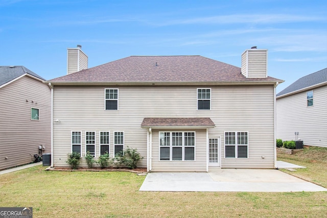 2036 Broadmoor Way, Fairburn, GA 30213 - rear view of house featuring a lawn, a chimney, and a patio area