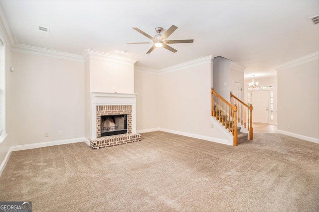 2036 Broadmoor Way, Fairburn, GA 30213 - unfurnished living room featuring stairway, ornamental molding, ceiling fan with notable chandelier, visible vents, and a fireplace