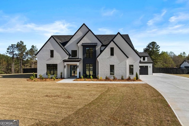 view of front of home featuring fence, a garage, stucco siding, a front lawn, and driveway
