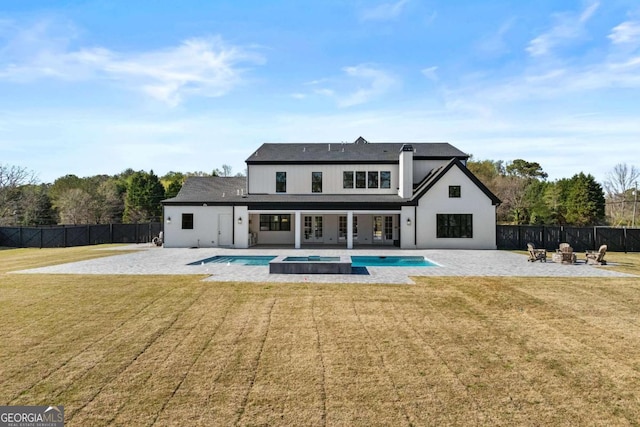 2485 Brooks Rd, Dacula, GA 30019 - rear view of house featuring a fire pit, a pool with connected hot tub, french doors, and a patio area