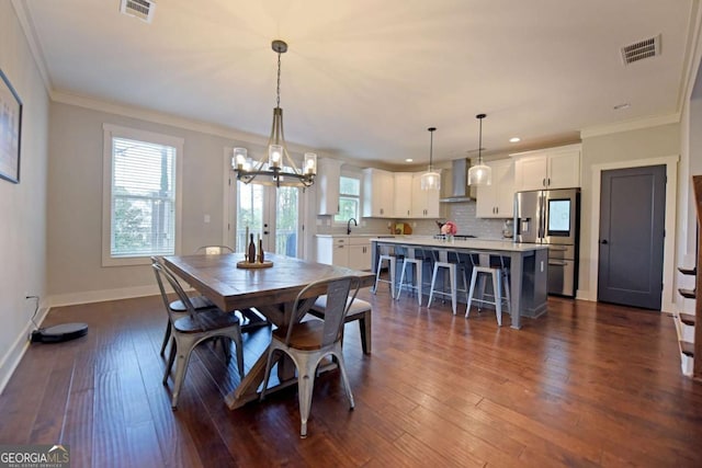 1494 Addison Pl, Decatur, GA 30033 - dining area featuring a chandelier, baseboards, crown molding, dark wood-style flooring, and recessed lighting