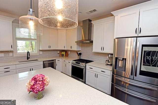 1494 Addison Pl, Decatur, GA 30033 - kitchen featuring appliances with stainless steel finishes, wall chimney exhaust hood, a sink, backsplash, and white cabinetry