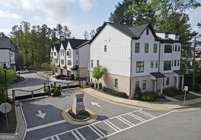 1494 Addison Pl, Decatur, GA 30033 - view of asphalt street with traffic signs, curbs, sidewalks, and a gate