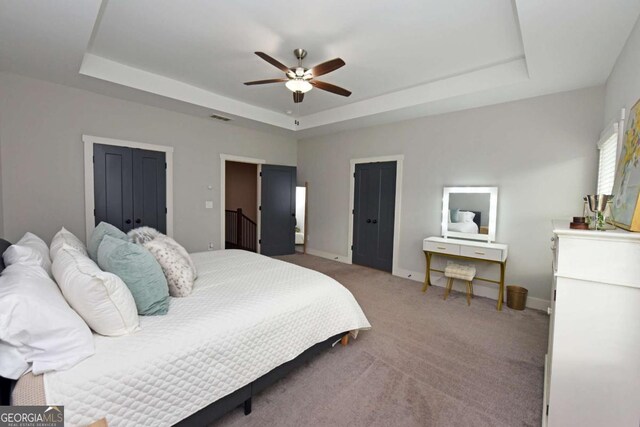 1494 Addison Pl, Decatur, GA 30033 - bedroom with a tray ceiling, baseboards, carpet floors, and a ceiling fan