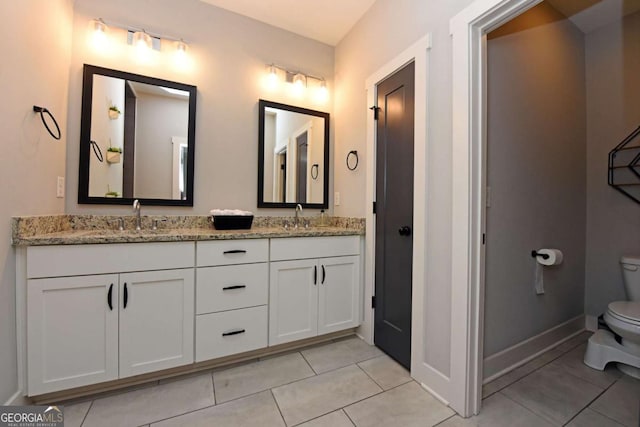 1494 Addison Pl, Decatur, GA 30033 - full bath with tile patterned flooring, toilet, double vanity, and baseboards