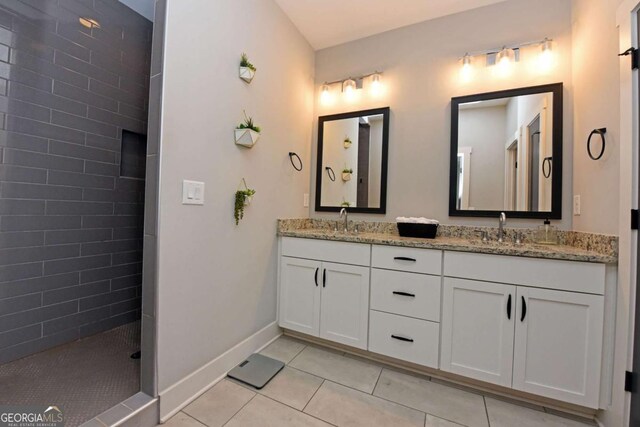 1494 Addison Pl, Decatur, GA 30033 - full bathroom with tile patterned flooring, double vanity, a walk in shower, and baseboards