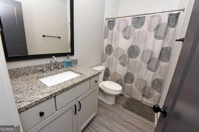 1494 Addison Pl, Decatur, GA 30033 - bathroom with toilet, vanity, and curtained shower