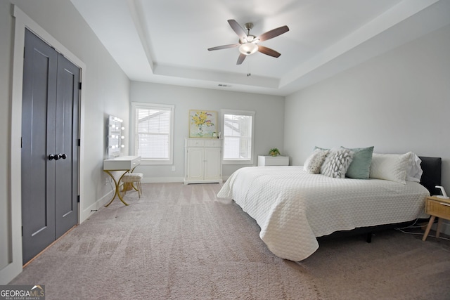1494 Addison Pl, Decatur, GA 30033 - carpeted bedroom with a raised ceiling, baseboards, and a ceiling fan