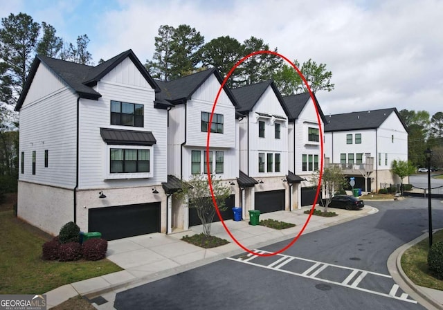 1494 Addison Pl, Decatur, GA 30033 - townhome / multi-family property featuring an attached garage, board and batten siding, driveway, a residential view, and a standing seam roof