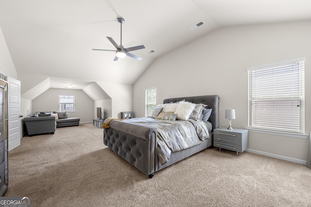 carpeted bedroom with vaulted ceiling, visible vents, a ceiling fan, and baseboards