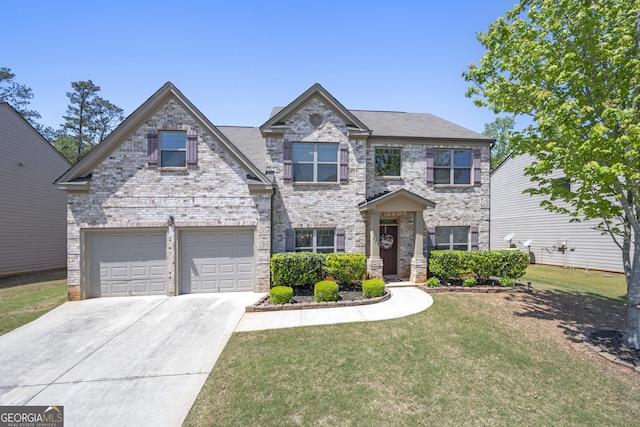 view of front of house with an attached garage, brick siding, a front yard, and concrete driveway