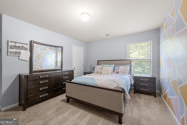 bedroom featuring light carpet, baseboards, and visible vents