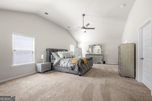 bedroom featuring light colored carpet, vaulted ceiling, and baseboards