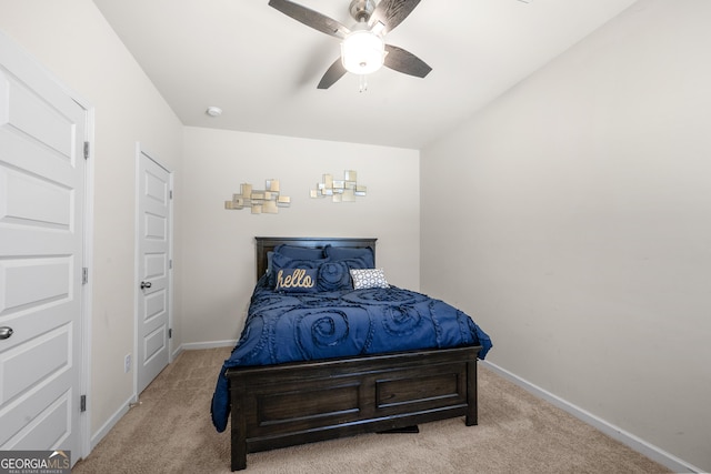 bedroom with carpet flooring, baseboards, and a ceiling fan