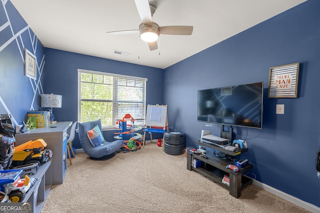 game room featuring baseboards, a ceiling fan, visible vents, and carpet
