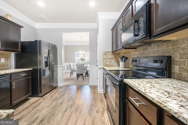 kitchen with crown molding, dark brown cabinetry, and black appliances