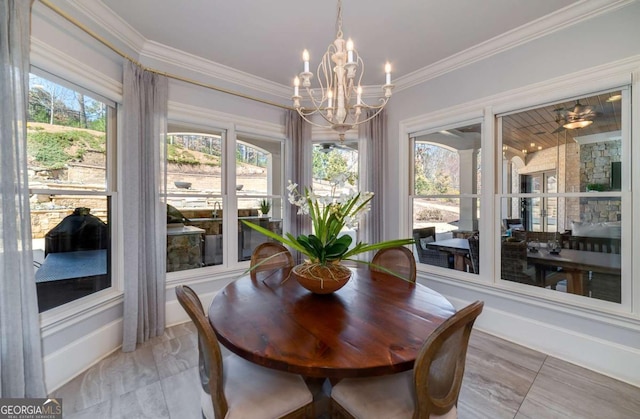 sunroom / solarium with a chandelier