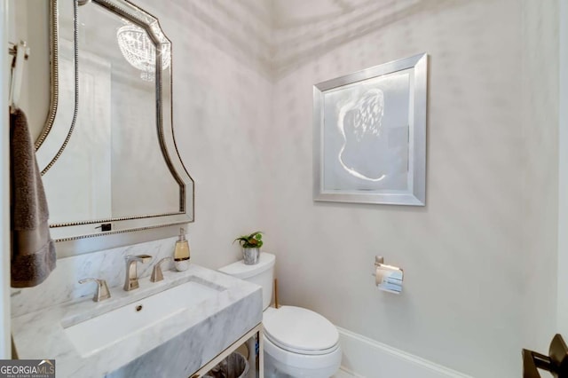 bathroom featuring toilet and a sink