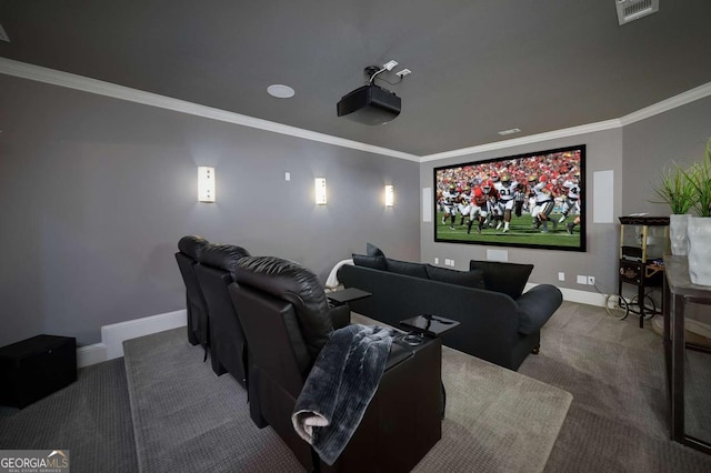 carpeted cinema with baseboards, visible vents, and ornamental molding
