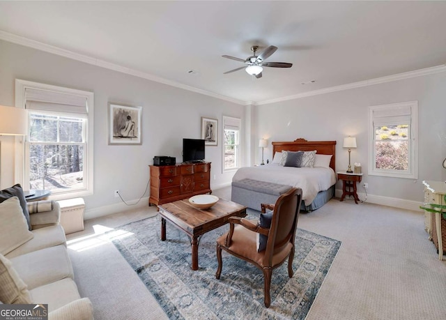 bedroom featuring baseboards, ornamental molding, and light carpet