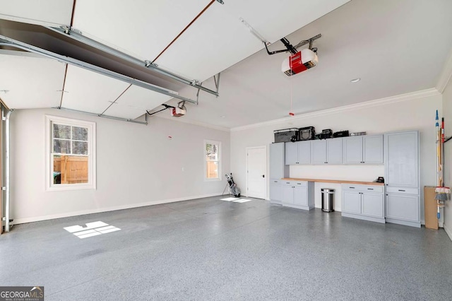 garage with baseboards and a garage door opener