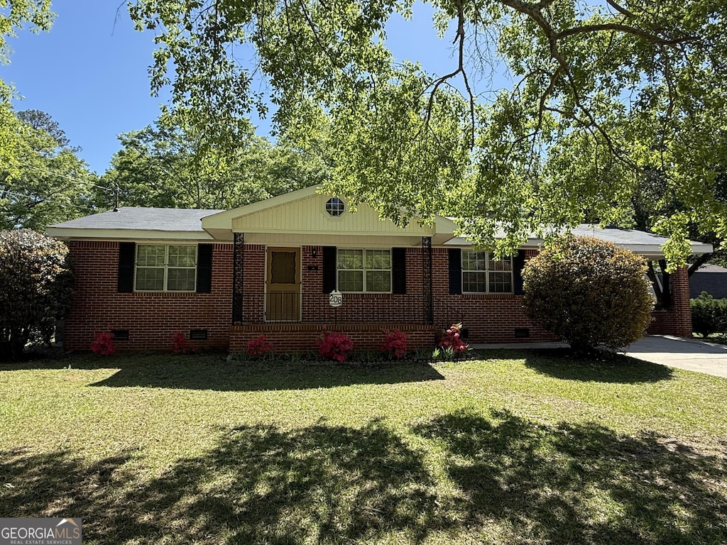 single story home featuring crawl space, a front lawn, and brick siding
