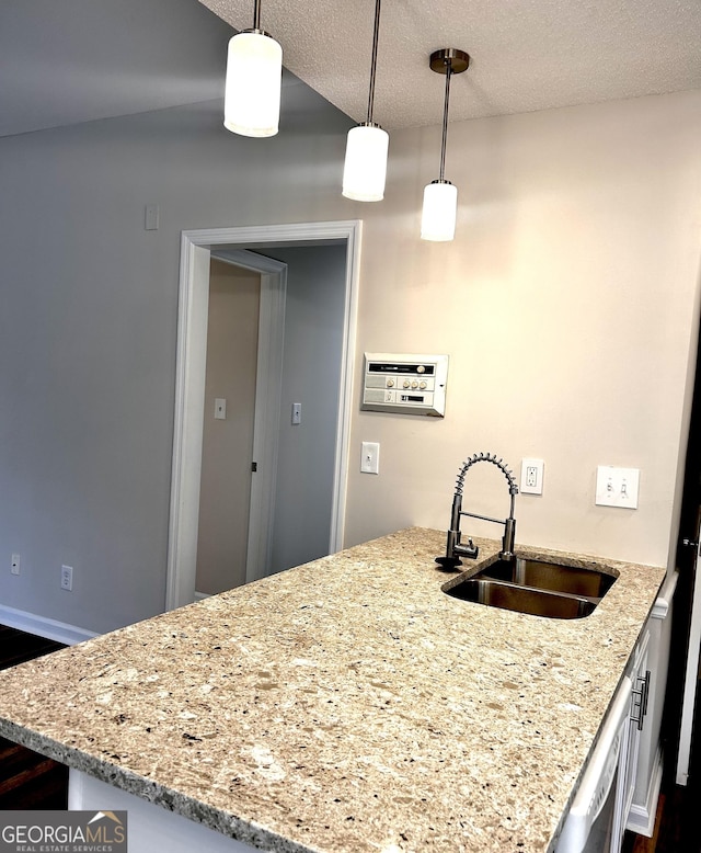 1864 Drew Cir, Austell, GA 30168 - kitchen featuring dark wood-style flooring, light stone countertops, hanging light fixtures, and a textured ceiling