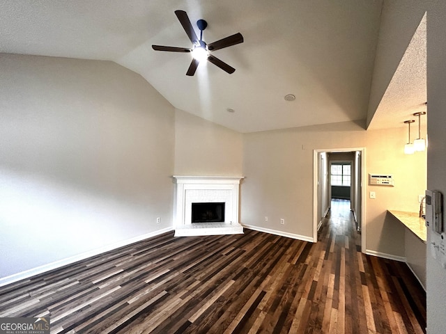 1864 Drew Cir, Austell, GA 30168 - unfurnished living room with lofted ceiling, a brick fireplace, ceiling fan, and dark wood-style floors