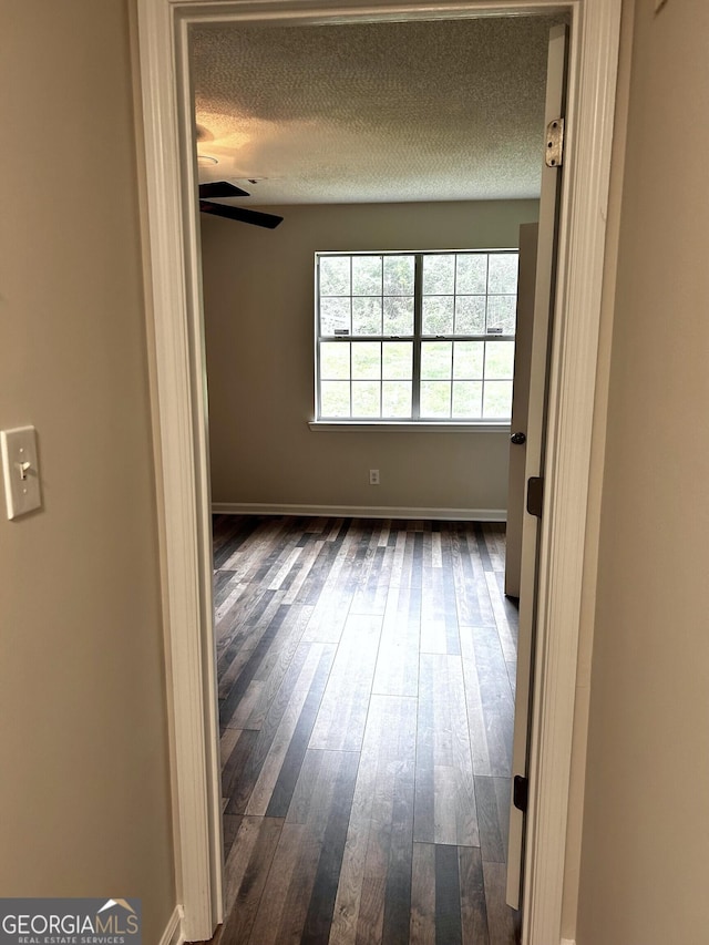 1864 Drew Cir, Austell, GA 30168 - empty room featuring a textured ceiling, dark wood finished floors, and a ceiling fan