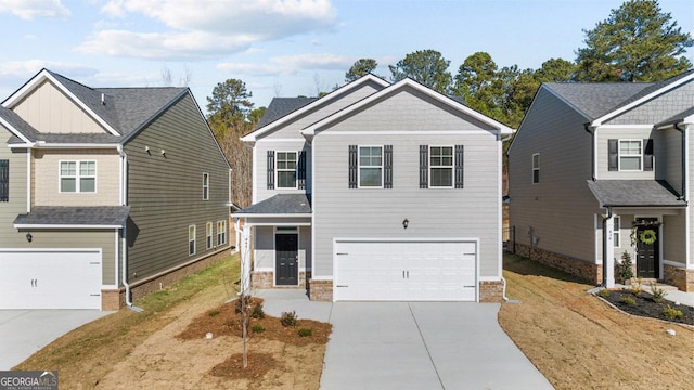 craftsman-style home with a garage and concrete driveway