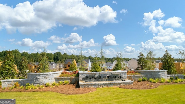 view of community with a residential view and a lawn