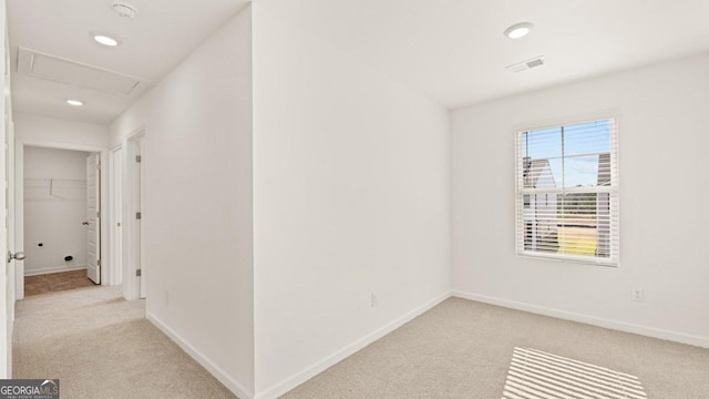 interior space with carpet flooring, baseboards, visible vents, and recessed lighting