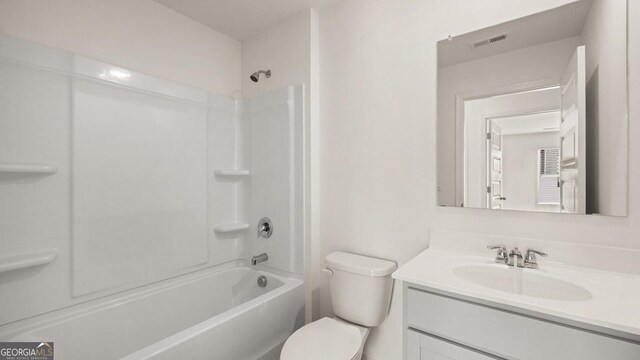 bathroom featuring toilet, vanity, shower / tub combination, and visible vents