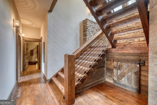 1329 Grandeur Dr, Blue Ridge, GA 30513 - staircase with hardwood / wood-style floors and a textured wall