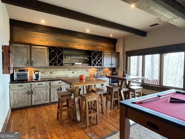 1329 Grandeur Dr, Blue Ridge, GA 30513 - bar with a toaster, backsplash, a sink, beam ceiling, and wood finished floors