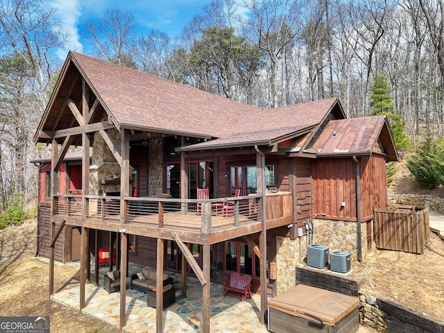 1329 Grandeur Dr, Blue Ridge, GA 30513 - back of house featuring stone siding, a patio, a deck, an outdoor living space, and a shingled roof