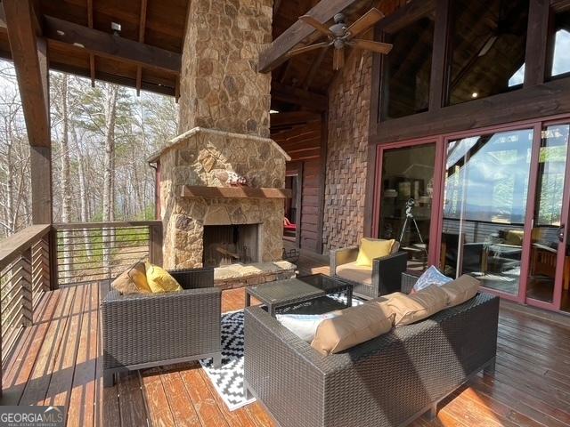 1329 Grandeur Dr, Blue Ridge, GA 30513 - wooden deck featuring an outdoor living space with a fireplace and ceiling fan