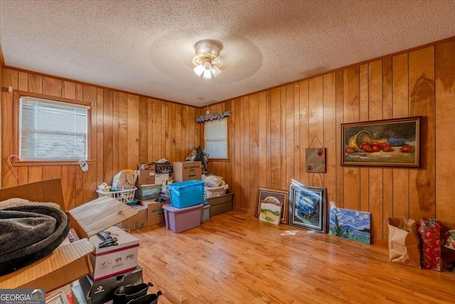 254 E Girard Ave, Cedartown, GA 30125 - dining area with wood finished floors, a textured ceiling, wood walls, and a ceiling fan