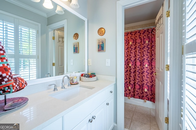 bathroom featuring ornamental molding and a healthy amount of sunlight