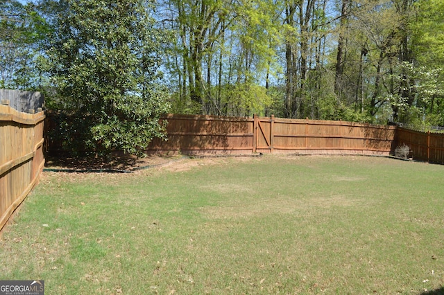 view of yard featuring a fenced backyard