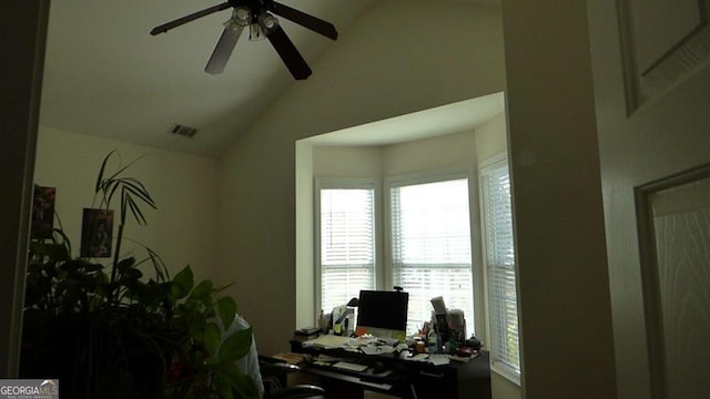 office area featuring a ceiling fan, vaulted ceiling, and visible vents