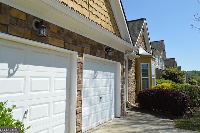garage featuring driveway