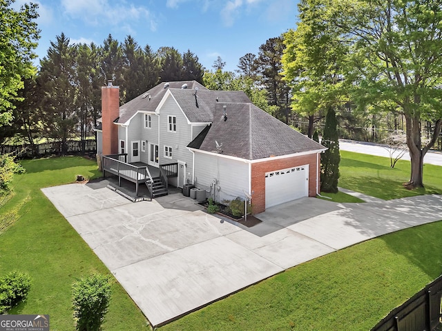 view of property exterior with driveway, an attached garage, central air condition unit, a wooden deck, and brick siding