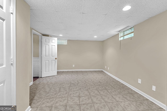below grade area featuring baseboards and recessed lighting