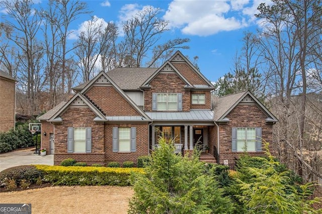 1190 Mosspointe Dr, Roswell, GA 30075 - craftsman-style house featuring a porch, stone siding, brick siding, and a standing seam roof