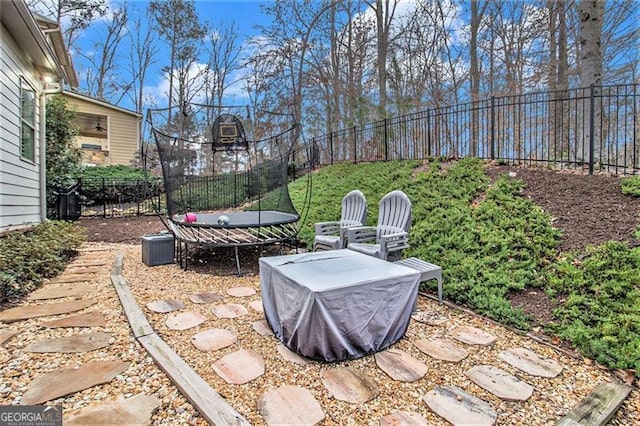 1190 Mosspointe Dr, Roswell, GA 30075 - view of patio / terrace with fence and a trampoline
