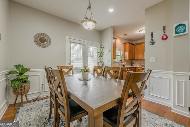 2705 Maple Park Pl Unit 29, Cumming, GA 30041 - dining area with recessed lighting, wainscoting, and light wood finished floors