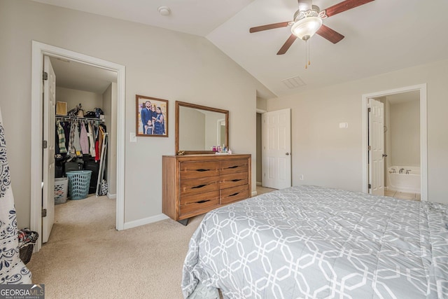 2705 Maple Park Pl Unit 29, Cumming, GA 30041 - bedroom featuring vaulted ceiling, a closet, a walk in closet, baseboards, and light colored carpet