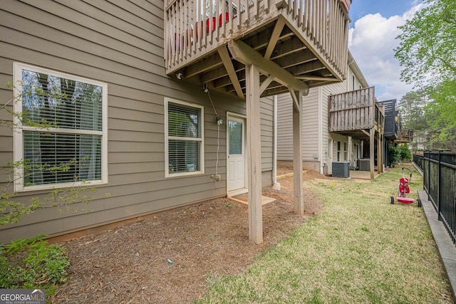 2705 Maple Park Pl Unit 29, Cumming, GA 30041 - view of yard featuring central air condition unit, a wooden deck, and fence